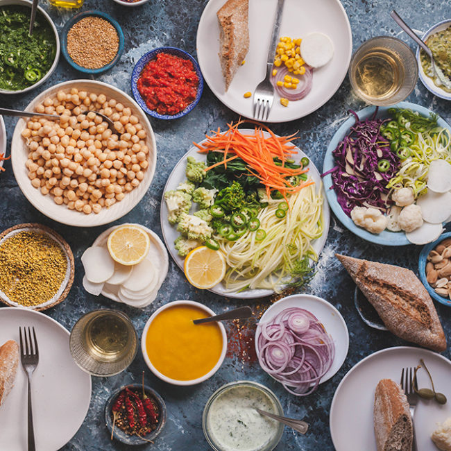 Vegan veggies meals on dinning table flat lay detox dieting food concept